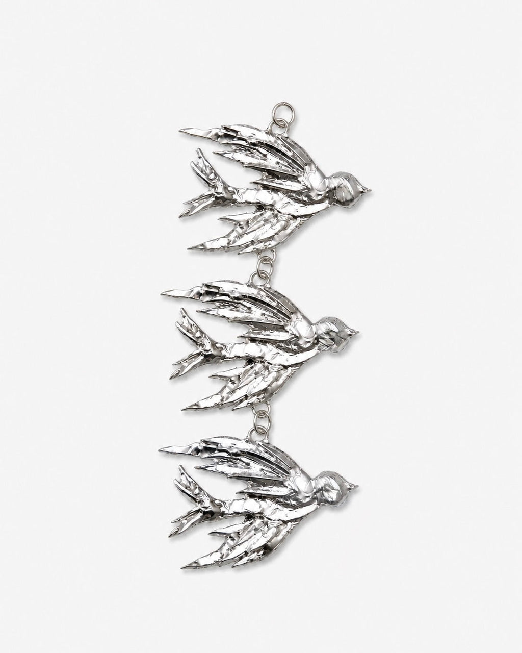 Silver bird-shaped pendant on a white background